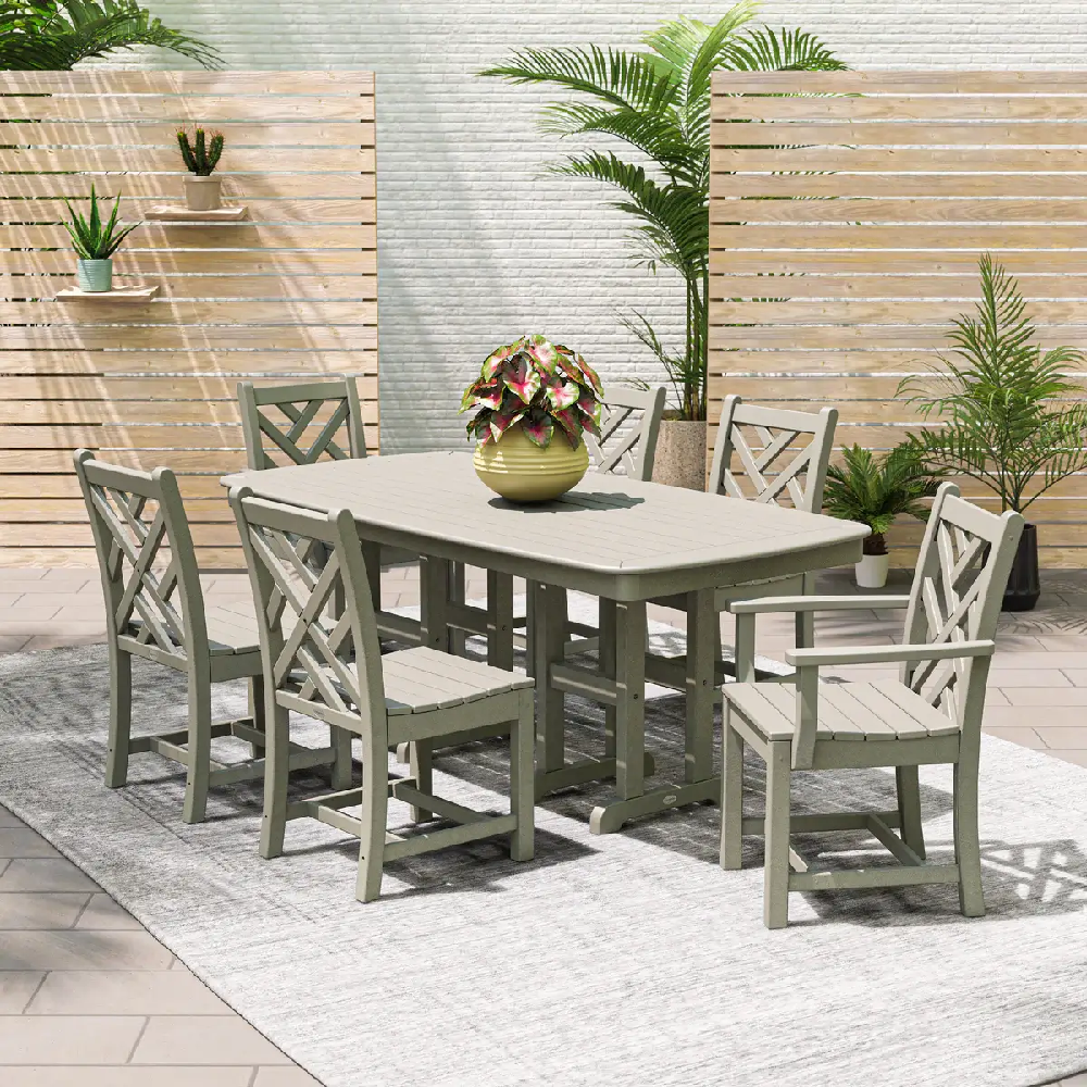 Elegant outdoor dining area featuring a gray Chippendale-style dining set for upscale patios and hospitality spaces.
